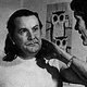 Filmmaker Ed Wood talks to another man on the set of a movie.